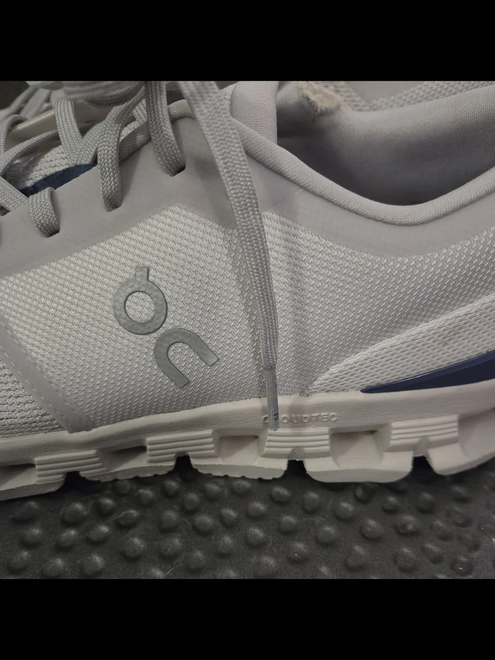 On Running Sneakers in Light Gray with Navy Tongue Accents